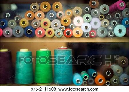 a lot of bobbins of sewing threads in a warehouse in London, England, UK, Europe. View Large Photo Image Stock Photo - a lot of bobbins of sewing threads in a warehouse in London, England, UK, Europe.. Fotosearch