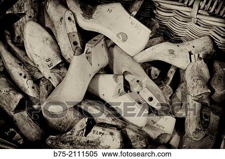 a lot of wooden shoe lasts in a basket in a warehouse in London, England, UK, Europe. View Large Photo Image Stock Photography - a lot of wooden shoe lasts in a basket in a warehouse in London, England, UK, Europe.. Fotosearch