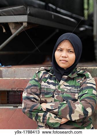 A Malaysian female soldier stands in front of a transport truck View Large Photo Image Stock Image - A Malaysian female soldier stands in front of a transport truck. Fotosearch