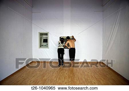 A man and a woman take money from an ATM austere. China View Large Photo Image Stock Photography - A man and a woman take money from an ATM austere. China. Fotosearch