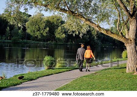 A man and a woman walk along the Avon River, Stratford, Ontario, Canada A world famous Shakespeare Festival draws thousands of visitors here every year View Large Photo Image Stock Image - A man and a woman walk along the Avon River, Stratford, Ontario, Canada A world famous Shakespeare Festival draws thousands of visitors here every year. Fotosearch