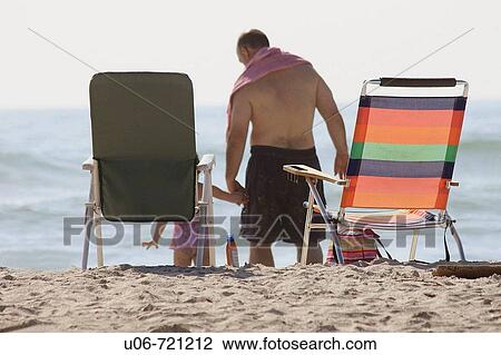 a man and child on a beach View Large Photo Image Stock Image - a man and child on a beach. Fotosearch