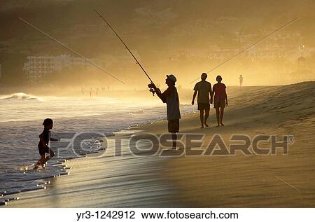 A man fishes along a beach of resort hotels in San Jose del Cabo in Mexico's southern Baja California state. View Large Photo Image Stock Image - A man fishes along a beach of resort hotels in San Jose del Cabo in Mexico's southern Baja California state.. Fotosearch