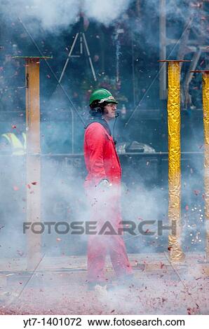 A man lighting Chinese fire crackers at Trafalgar square during the New year celebrations year of the rabbit 2001 London, UK View Large Photo Image Stock Image - A man lighting Chinese fire crackers at Trafalgar square during the New year celebrations year of the rabbit 2001 London, UK. Fotosearch