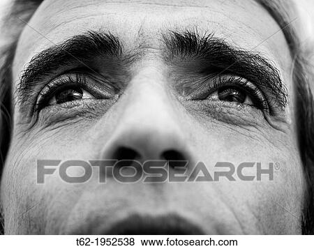 A man looks up with pleading eyes. View Large Photo Image Stock Photo - A man looks up with pleading eyes.. Fotosearch