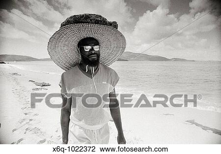 Stock Image - A man on a delightful beach in the Virgin Isles. Fotosearch