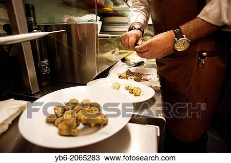 a man prepares white truffles in a kitchen, Venice, Italy. View Large Photo Image Stock Image - a man prepares white truffles in a kitchen, Venice, Italy.. Fotosearch
