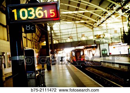 A man standing on the platform of York train station. Yorkshire, England, UK, Europe. View Large Photo Image Stock Image - A man standing on the platform of York train station. Yorkshire, England, UK, Europe.. Fotosearch