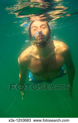 A man submerging from underwater Mediterranean sea Italy View Large Photo Image Stock Image - A man submerging from underwater Mediterranean sea Italy. Fotosearch