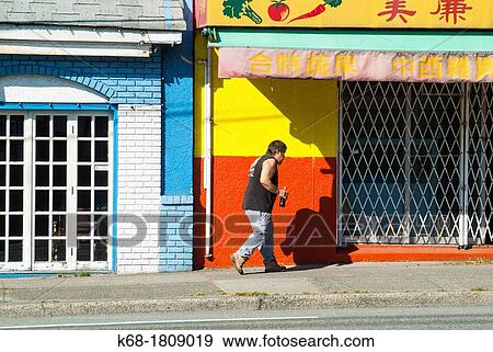 a man walks on East Hastings Street, in Vancouver, BC, Canada View Large Photo Image Stock Photo - a man walks on East Hastings Street, in Vancouver, BC, Canada. Fotosearch