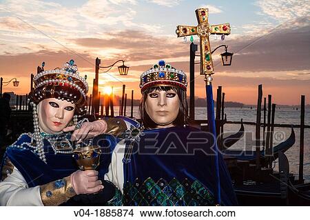 A masked couple at the carnival in Venice, Italy, Europe View Large Photo Image Picture - A masked couple at the carnival in Venice, Italy, Europe. Fotosearch