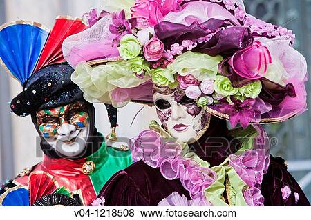 Stock Photo - A masked couple at the carnival in Venice, Italy, Europe. Fotosearch