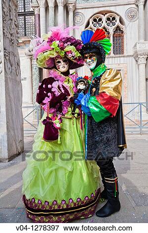 Stock Photo - A masked couple at the carnival in Venice, Italy, Europe. Fotosearch