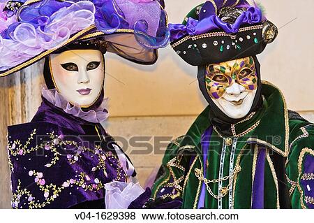 Stock Photo - A masked couple at the carnival in Venice, Italy, Europe. Fotosearch