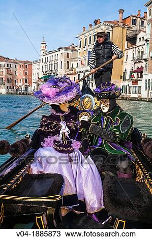 A masked couple in a gondola at the carnival in Venice, Italy, Europe View Large Photo Image Stock Image - A masked couple in a gondola at the carnival in Venice, Italy, Europe. Fotosearch