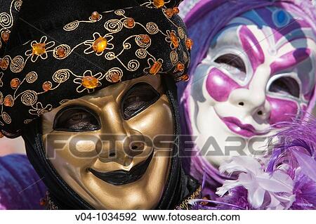 A masked couple looking affectionately at each other at the carnival in Venice, Italy, Europe View Large Photo Image Stock Image - A masked couple looking affectionately at each other at the carnival in Venice, Italy, Europe. Fotosearch