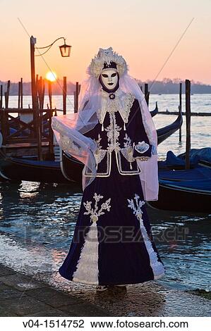 Stock Image - A masked woman at the carnival in Venice, Italy, Europe. Fotosearch