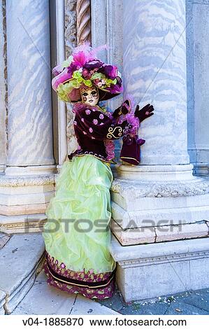 Stock Image - A masked woman at the carnival in Venice, Italy, Europe. Fotosearch