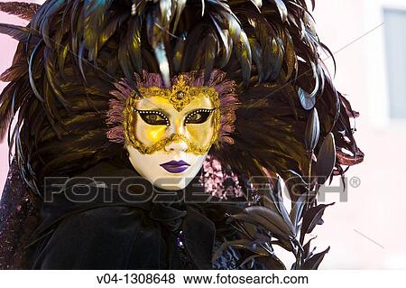 Stock Photo - A masked woman at the carnival in Venice, Italy, Europe. Fotosearch