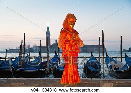 Stock Photo - A masked woman at the carnival in Venice, Italy, Europe. Fotosearch