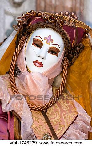 Stock Photo - A masked woman at the carnival in Venice, Italy, Europe. Fotosearch