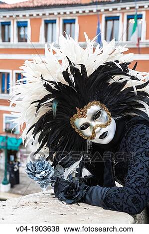 Stock Photo - A masked woman at the carnival in Venice, Italy, Europe. Fotosearch