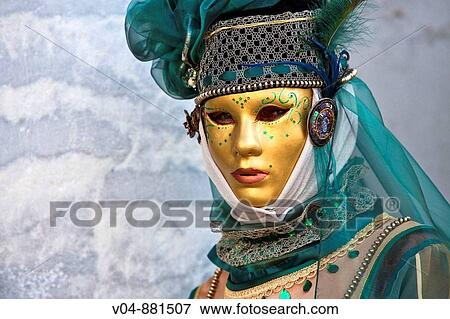 Stock Photo - A masked woman at the carnival in Venice, Italy, Europe. Fotosearch