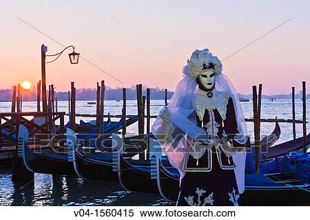 A masked woman at the carnival in Venice with gondolas in the background, Italy, Europe View Large Photo Image Stock Photography - A masked woman at the carnival in Venice with gondolas in the background, Italy, Europe. Fotosearch