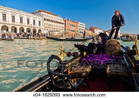 A masked woman during carnival in a gondola on the Canale Grande, Venice, Italy, Europe View Large Photo Image Stock Image - A masked woman during carnival in a gondola on the Canale Grande, Venice, Italy, Europe. Fotosearch