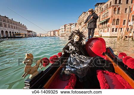 A masked woman during carnival in a gondola on the Canale Grande, Venice, Italy, Europe View Large Photo Image Stock Photography - A masked woman during carnival in a gondola on the Canale Grande, Venice, Italy, Europe. Fotosearch