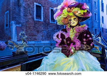A masked woman in a gondola at the carnival in Venice, Italy, Europe View Large Photo Image Stock Image - A masked woman in a gondola at the carnival in Venice, Italy, Europe. Fotosearch