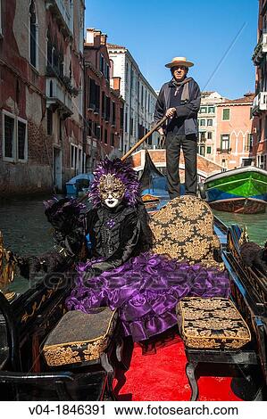 A masked woman in a gondola at the carnival in Venice, Italy, Europe View Large Photo Image Stock Image - A masked woman in a gondola at the carnival in Venice, Italy, Europe. Fotosearch