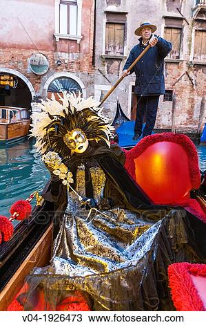 A masked woman in a gondola at the carnival in Venice, Italy, Europe View Large Photo Image Stock Image - A masked woman in a gondola at the carnival in Venice, Italy, Europe. Fotosearch