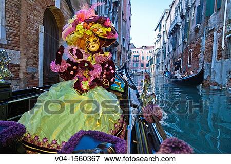 A masked woman in a gondola at the carnival in Venice, Italy, Europe View Large Photo Image Stock Photo - A masked woman in a gondola at the carnival in Venice, Italy, Europe. Fotosearch