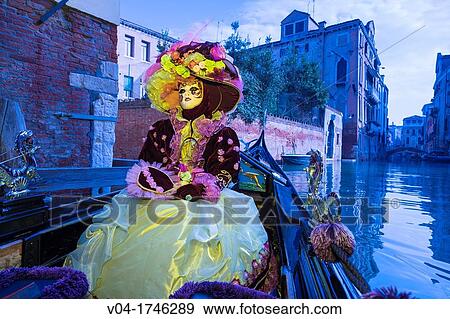 A masked woman in a gondola at the carnival in Venice, Italy, Europe View Large Photo Image Stock Photo - A masked woman in a gondola at the carnival in Venice, Italy, Europe. Fotosearch