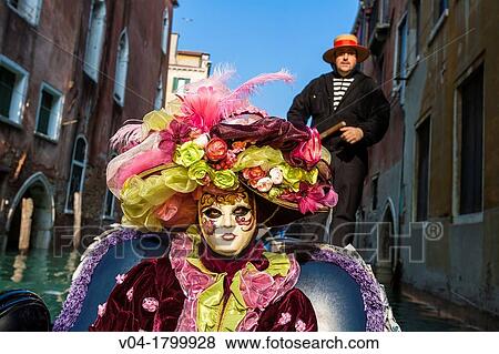 A masked woman in a gondola at the carnival in Venice, Italy, Europe View Large Photo Image Stock Photo - A masked woman in a gondola at the carnival in Venice, Italy, Europe. Fotosearch