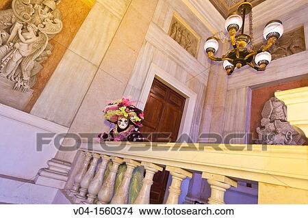 A masked woman leaning over a balcony at the carnival in Venice, Italy, Europe View Large Photo Image Picture - A masked woman leaning over a balcony at the carnival in Venice, Italy, Europe. Fotosearch