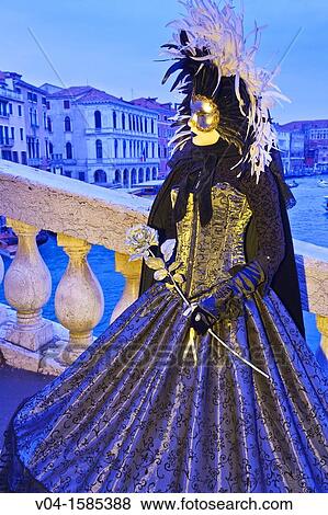 A masked woman on the Rialto Bridge at the carnival in Venice, Italy, Europe View Large Photo Image Stock Photo - A masked woman on the Rialto Bridge at the carnival in Venice, Italy, Europe. Fotosearch