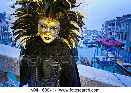 A masked woman on the Rialto Bridge at the carnival in Venice, Italy, Europe View Large Photo Image Stock Photo - A masked woman on the Rialto Bridge at the carnival in Venice, Italy, Europe. Fotosearch