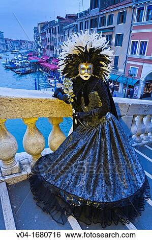 A masked woman on the Rialto Bridge at the carnival in Venice, Italy, Europe View Large Photo Image Stock Photograph - A masked woman on the Rialto Bridge at the carnival in Venice, Italy, Europe. Fotosearch