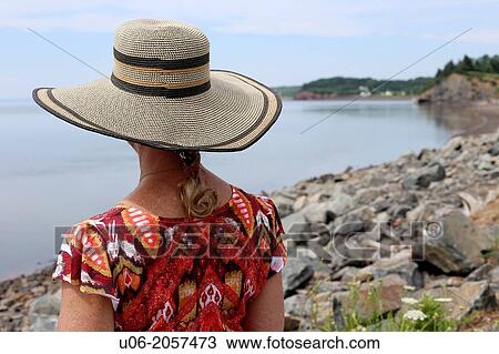 A middle aged to senior woman with a wide brimmed hat viewing the Minas basin from Noel, Nova Scotia, canada View Large Photo Image Stock Image - A middle aged to senior woman with a wide brimmed hat viewing the Minas basin from Noel, Nova Scotia, canada. Fotosearch