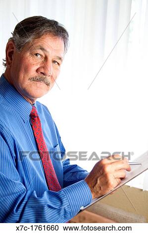 Stock Image - A middle-aged white caucasion man serving as a professional, doctor, veterinarian. Fotosearch