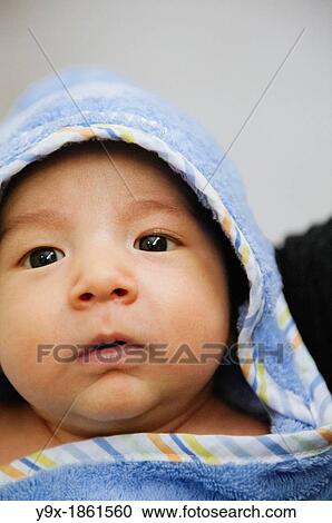 A mixed ethnicity baby wrapped in a blue towel blanket View Large Photo Image Stock Image - A mixed ethnicity baby wrapped in a blue towel blanket. Fotosearch
