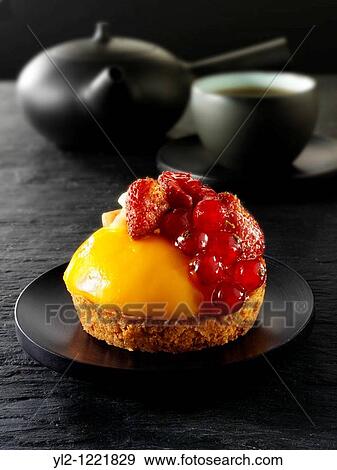 A modern fruit cake with redcurrants, wild strawberries, blacberry and creme patisserie in a light sponge case Traditionl black Japanese tea setting View Large Photo Image Stock Photo - A modern fruit cake with redcurrants, wild strawberries, blacberry and creme patisserie in a light sponge case Traditionl black Japanese tea setting. Fotosearch