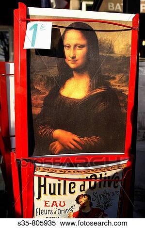 Stock Photography - A Mona Lisa poster for sale for 1 euro in a street of Paris. France. Fotosearch