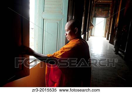 A monk closes a window in a small village temple outside of Phnom Penh, Cambodia. View Large Photo Image Stock Photography - A monk closes a window in a small village temple outside of Phnom Penh, Cambodia.. Fotosearch
