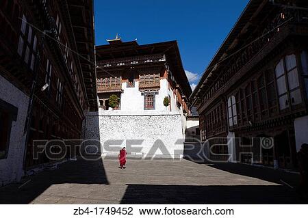 Stock Image - A monk in Trongsa Dzong, Trongsa, Bhutan, Asia.. Fotosearch