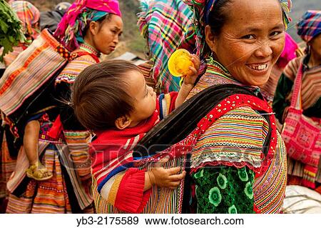 A Mother and Child From The Flower Hmong Hill Tribe At The Ethnic Market In Can Cau, Lao Cai Province, Vietnam. View Large Photo Image Stock Photo - A Mother and Child From The Flower Hmong Hill Tribe At The Ethnic Market In Can Cau, Lao Cai Province, Vietnam.. Fotosearch