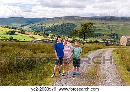 A mother and her 2 sons out on a family walk in Swaledale, North Yorkshire, England, Britain, Uk. View Large Photo Image Stock Photo - A mother and her 2 sons out on a family walk in Swaledale, North Yorkshire, England, Britain, Uk.. Fotosearch