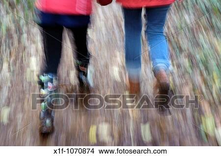 A mother and her daughter walking in autumn woodland Pembrokeshire Wales UK View Large Photo Image Picture - A mother and her daughter walking in autumn woodland Pembrokeshire Wales UK. Fotosearch